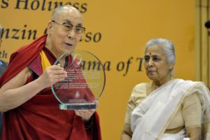 His Holiness the Dalai Lama holding a plaque denoting his receipt of the Professor ML Sondhi Prize for International Politics presented to him in New Delhi, India on April 27, 2017. Photo by Jeremy Russell/OHHDL